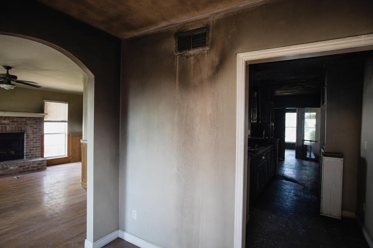 12 Signs of Smoke Damage Lewisville Homeowners Should Never Ignore Smoke and soot staining on walls inside a Lewisville home